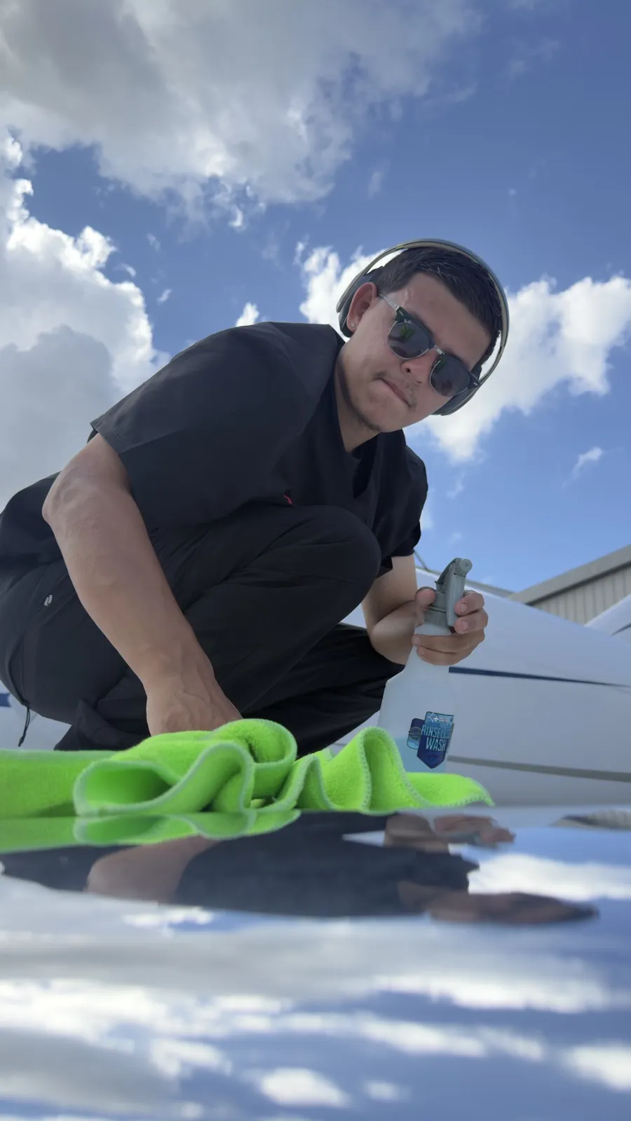 Hand-detailing the wing of a private jet