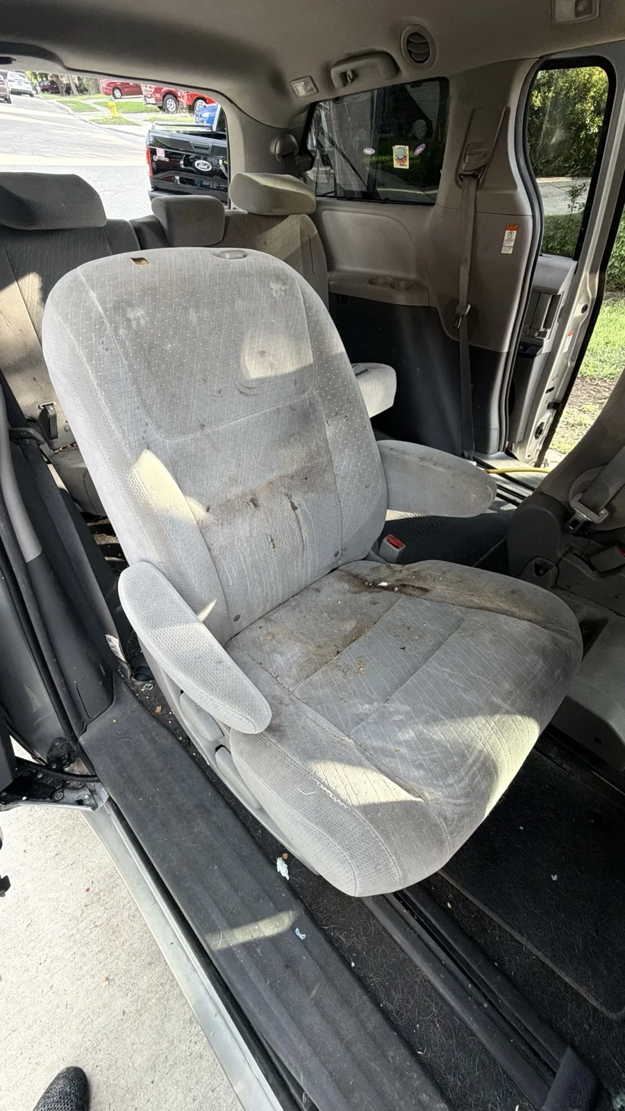 Van interior before: stained cloth seats